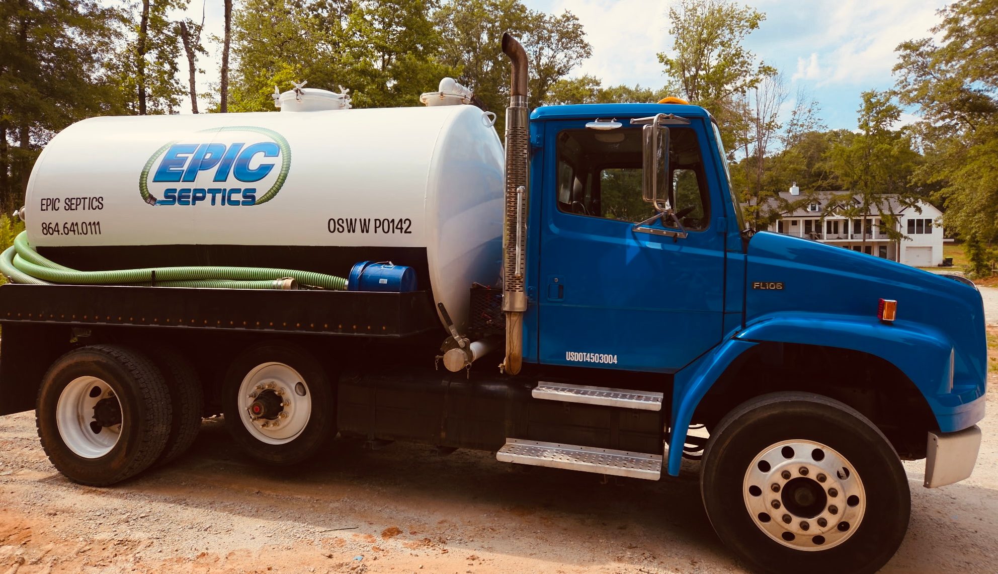Epic Septics technician performing professional septic tank pumping at a residential property in Spartanburg County, South Carolina